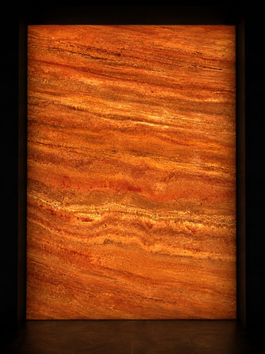 Persian Red Travertine in museum light